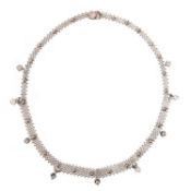 A DIAMOND COLLAR NECKLACE, of mesh design set with pellet decoration and diamond drops in white