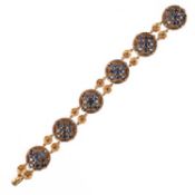 A SAPPHIRE AND DIAMOND BRACELET, composed of circular ropetwist links set with circular-cut