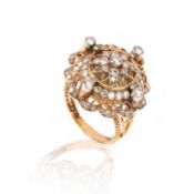 VACHERON CONSTANTIN, A DIAMOND RING WATCH, of reticulated and diamond-set bombé design, quartered