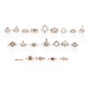 A LARGE OF COLLECTION OF 21 DIAMOND-SET RING MOUNTS, comprising; a diamond dress ring mount, set