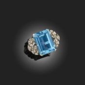 AN AQUAMARINE AND DIAMOND DRESS RING, set with an emerald cut aquamarine weighing approximately 13.