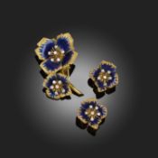 CARTIER, AN ENAMEL AND DIAMOND DEMI PARURE, C1960, comprising a stylised flower brooch decorated