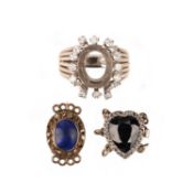 A DIAMOND-SET RING MOUNT AND TWO CLASPS, including a mount for an oval stone set within a surround