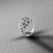 CARTIER, A GEM-SET PANTHÈRE RING, C1980s, designed as a crouching panther, pavé-set with round