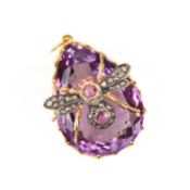 A GEM-SET INSECT PENDANT, the large pear-shaped amethyst in a scrolling silver gilt mount, set