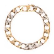 A DIAMOND-SET GOLD BRACELET, of bi-colour gold flat curb-linking, set alternately every three