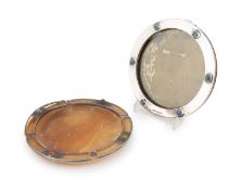By Liberty & Co., an Edwardian silver-mounted photograph frame, Birmingham 1906, circular form set