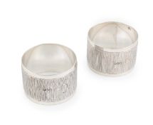 By Gerald Benney, a pair of modern silver napkin rings, London 1968, circular form with a band of