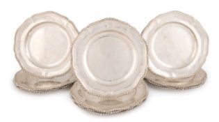 A set of twelve Victorian silver plates, by Robert Garrard, London 1869 and one 1868, circular