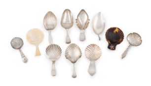 λ A collection of antique silver caddy spoons, including: one by Nathaniel Smith & Co., Sheffield
