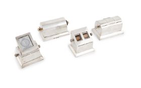 A collection of four antique silver stamp dispensers, comprising: two by Charles & George Asprey,