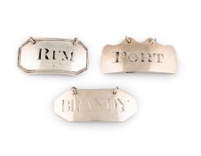 A small collection of three provincial silver wine labels, comprising: a George III one, by Hampston