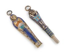 Two novelty silver-gilt, silver and enamel propelling pencils, unmarked, modelled as an Egyptian