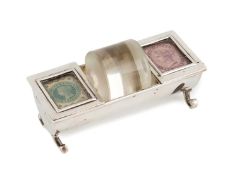 An Edwardian silver stamp case with a glass stamp roller, probably by John Grinsell & Sons,