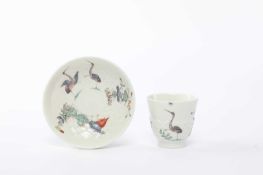 A SAINT CLOUD ARTICHOKE-MOULDED FLARED CUP AND SAUCER C.1730-40 painted in the kakiemon palette with