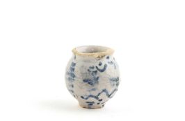 A DELFTWARE OINTMENT POT POSSIBLY LONDON, 18TH CENTURY of footed ovoid form, blue painted with dots,