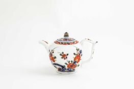A SMALL MEISSEN TEAPOT AND A MATCHED COVER C.1730-40 decorated with the Tischchenmuster pattern,