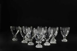 A SET OF TWELVE RUMMERS 19TH CENTURY each with an ogee bowl with cut and etched stylised foliate