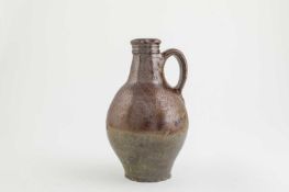 A JOHN DWIGHT STONEWARE BOTTLE FULHAM, C.1670-90 the pear-shaped body rising from a tall foot, the