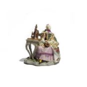 A MEISSEN FIGURE OF A LADY C.1750 seated beside a spinning wheel, reclining in a high-backed chair