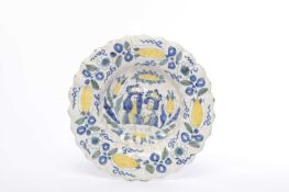 A WILLIAM AND MARY LOBED DELFTWARE CHARGER LATE 17TH CENTURY polychrome painted with portraits of