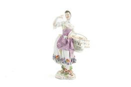 A MEISSEN FIGURE OF A LADY FLATBREAD SELLER C.1750 modelled by F E Meyer, she stands with her