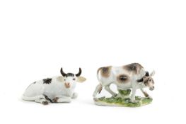 TWO MEISSEN MODELS OF A COW AND BULL C.1740-50 the recumbent cow after a model by J J Kändler with