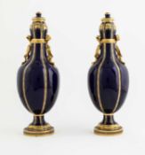 A PAIR OF ENGLISH PORCELAIN 'HAREWOOD BOTTLE' VASES AND COVERS PROBABLY MINTON, MID-19TH CENTURY