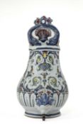 A ROUEN FAIENCE WALL CISTERN MID-18TH CENTURY the pear-shaped body with a twin dolphin surmount,