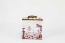 A SOUTH STAFFORDSHIRE ENAMEL TEA CANISTER AND COVER C.1770 of rectangular form, puce painted with