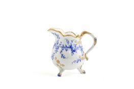 A SMALL SEVRES MILK JUG (POT A LAIT A TROIS PIED) C.1767 painted in blue enamel with a band of