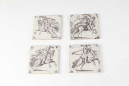 A SET OF FOUR DELFTWARE TILES DUTCH, C.1680 manganese painted with soldiers or saracens on horseback