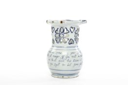 A DELFTWARE PUZZLE JUG PROBABLY LIVERPOOL, C.1760 painted with a four line verse inviting drinkers