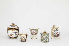 A SEVRES CREAM JUG DATE CODE FOR 1765 painted with exotic birds inside tooled gilt foliage, an ice