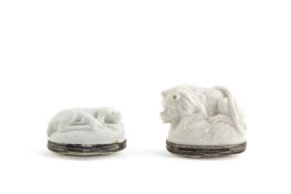 TWO MENNECY WHITE-GLAZED BONBONNIERES C.1740-50 one formed as a crouching lion, the other a