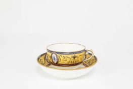 A SEVRES STYLE CUP AND SAUCER DATE CODE FOR 1792 painted with a central circular fan inside a border