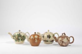 THREE STAFFORDSHIRE CREAMWARE TEAPOTS AND COVERS LATE 18TH CENTURY one with a crabstock handle and