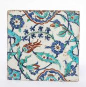 AN IZNIK TILE TURKEY, MID-LATE 16TH CENTURY painted in blue, red and turquoise with saz leaves,
