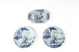 A PAIR OF DELFTWARE PLATES LONDON, C.1750 each blue painted with a couple by a rock before a ruin