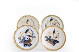 FOUR DELFTWARE PLATES 18TH / EARLY 19TH CENTURY each polychrome painted with parrots perched on a