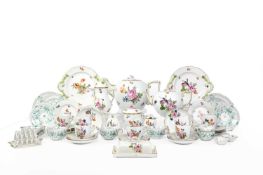 A HEREND PART SERVICE MODERN in a floral design, comprising: an outsized teapot and cover, a