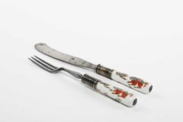 A KNIFE AND FORK WITH EARLY MEISSEN HANDLES C.1730-40 the handles painted in the kakiemon palette