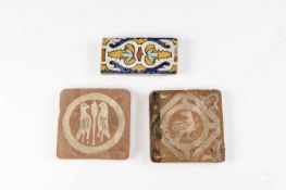 TWO MEDIEVAL ENCAUSTIC TILES C.1500 decorated in cream slip with a walking bird and a pair of birds,