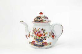 A MEISSEN TEAPOT AND COVER C.1730 moulded with a mask to the base of the spout, the body and cover