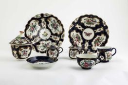 A COLLECTION OF WORCESTER BLUE GROUND WARES C.1770-80 comprising: two scale ground plates, one
