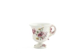 A MENNECY ICE CUP C.1760 with a scroll handle and domed foot, delicately painted with flower sprays,