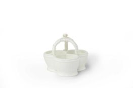 A SEVRES WHITE-GLAZED TRIPLE SALT C.1770 with a hoop handle and ribbon knop 10cm
