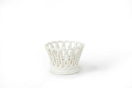 A SCEAUX WHITE-GLAZED SMALL BASKET SECOND HALF 18TH CENTURY with flared, pierced sides in the Sèvres