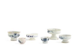 A COLLECTION OF FIVE DELFTWARE OINTMENT POTS 18TH CENTURY comprising: four footed examples with blue