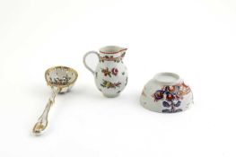 A WORCESTER SIFTER SPOON LATE 18TH CENTURY enamelled with flowers inside a feathered gilt rim and
